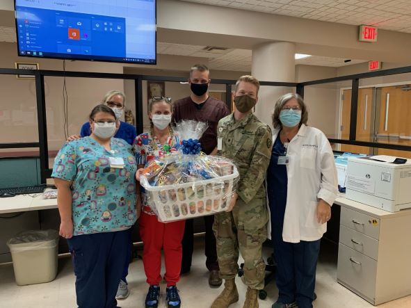 Nurses are Barbourville ARH hold a gift basket that was given to them as a token of appreciation.
