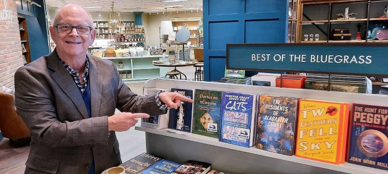 Jamie Vaught points to his book at the Joseph Beth Bookstore shelf.