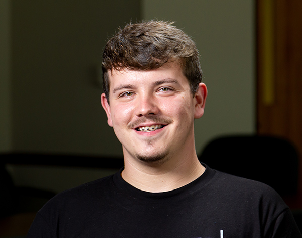 David Baldwin smiling for a photograph.