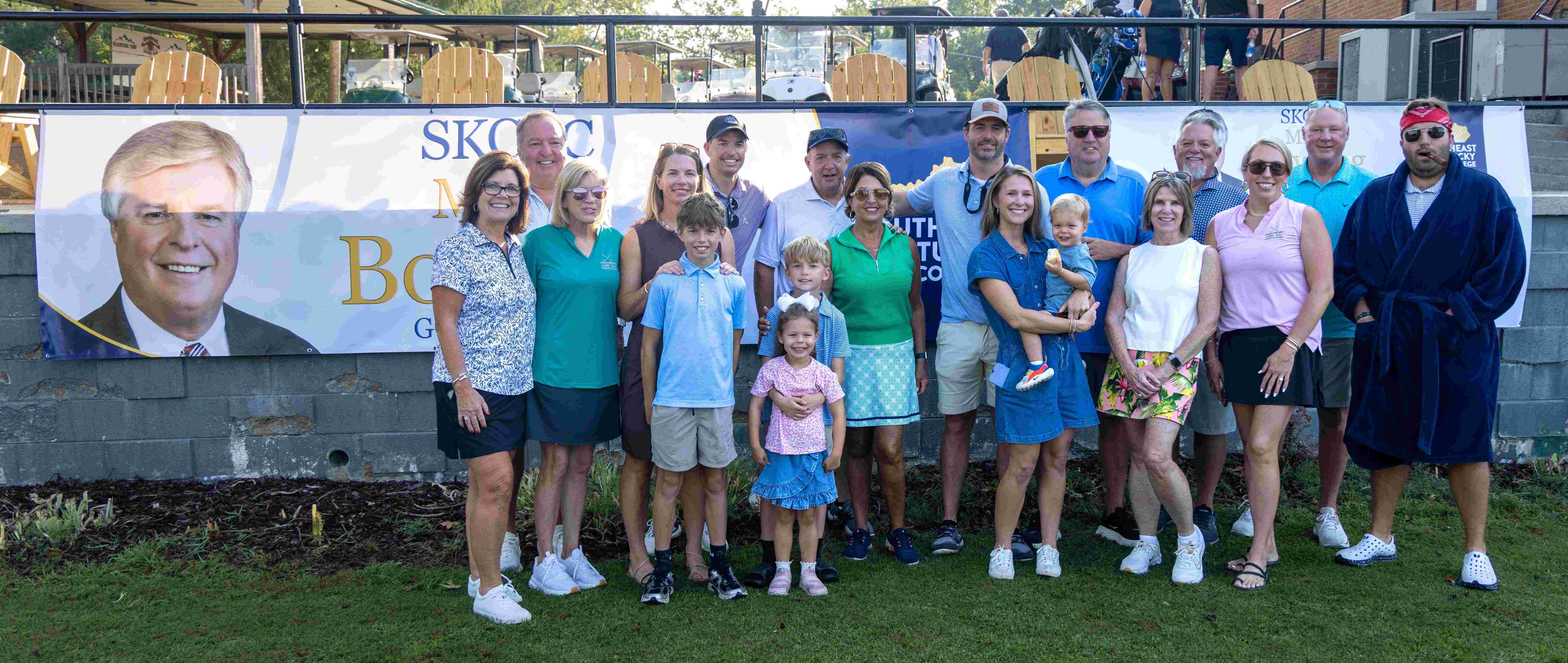 Members of the Bowling family pose together at the Mike Bowling Memorial Golf Tournament, celebrating a legacy of perseverance, service, and educational opportunity for future generations.